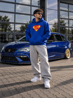 Super S blue oversized hoodie lifestyle photo with car